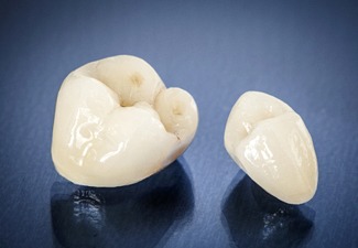 dental crowns sitting on a black countertop