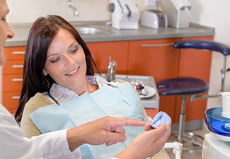 dentist pointing to tooth restoration