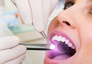 woman getting oral cancer screening