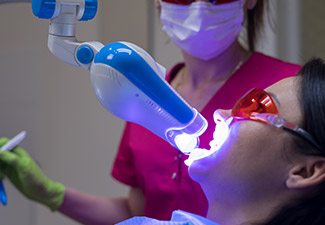 woman getting teeth whitening