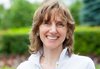 woman in white smiling