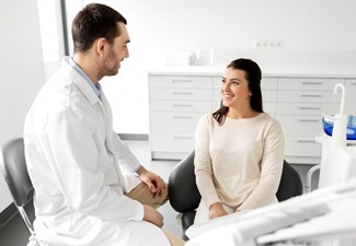 Dentist and patient discussing how NightLase treatment works