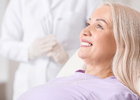 woman smiling after getting dental implants in Leawood