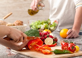 People preparing food for a meal