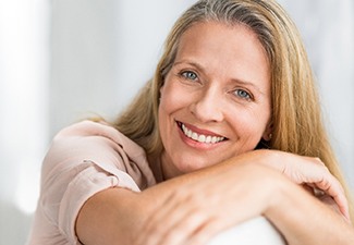 Older woman with dental implants in Leawood smiling