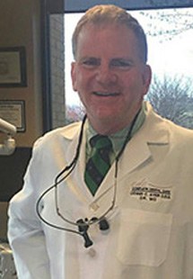 Headshot of Dr. Dennis Ayer 