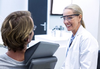 Dentist in Leawood smiling at a patient