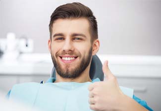 Male patient giving thumbs up for ozone therapy