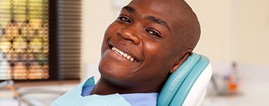 man relaxing in exam chair