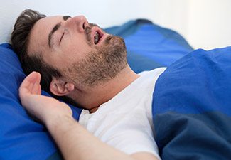 man struggling to sleep 