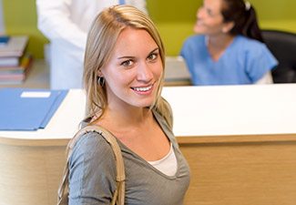 woman smiling up at camera