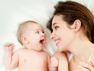 Smiling mother and baby