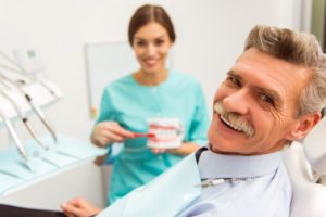 gray-haired man visiting his dentist for seniors in Leawood 