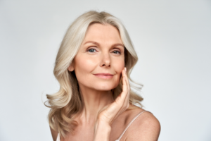 a woman smiling after receiving BOTOX