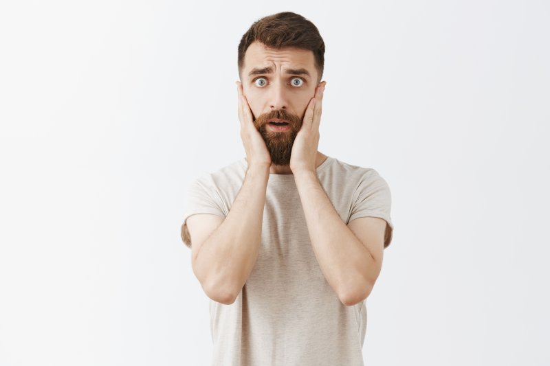 Man surprised after his dental bridge falls out